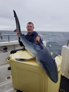 Blue shark held on Silver Dawn during a shark fishing charter
