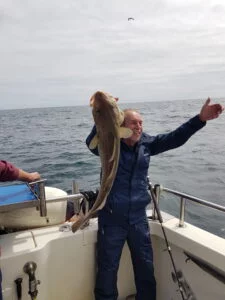 Cod being held with delight on Silver Dawn
