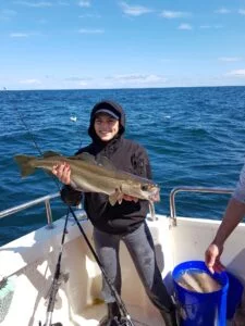 Pollack being held on Silver Dawn during general fishing charter